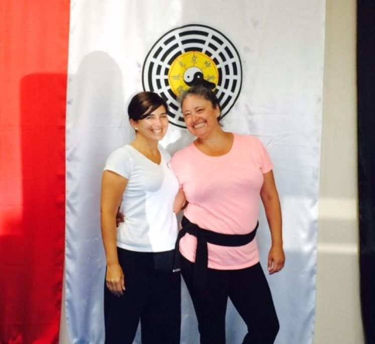 Instructor Elisa Dias Sweigart receives her Black Belt